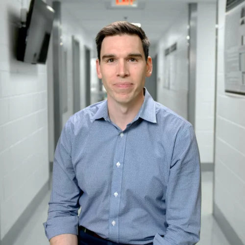 Corporate headshot photographed for company profile.