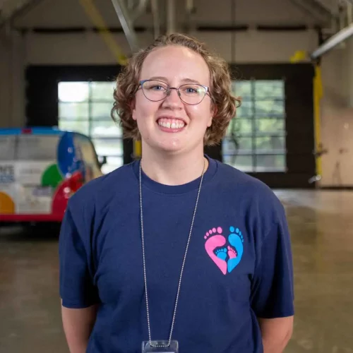 Volunteer portrait taken at nonprofit organization workspace.