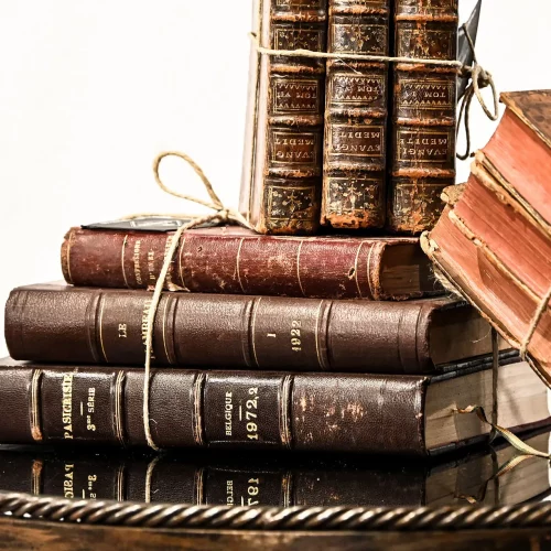 Stack of antique books styled for commercial product photography at High Point Furniture Market.