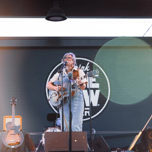 Solo musician performing at outdoor music event in Tennessee.