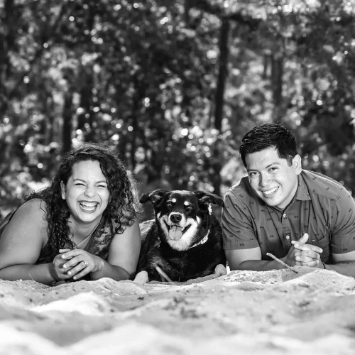Black and white outdoor family photo captured during an engagement shoot.