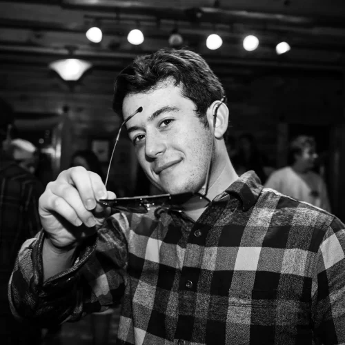 Black-and-white portrait of musician captured during live event shoot.