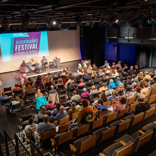 Full auditorium at literary festival keynote captured by MJS Live Productions.