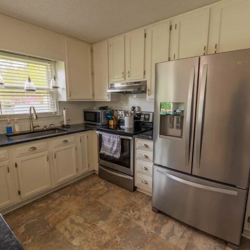 Renovated kitchen interior highlighting open layout and stainless appliances in Clemmons, North Carolina.
