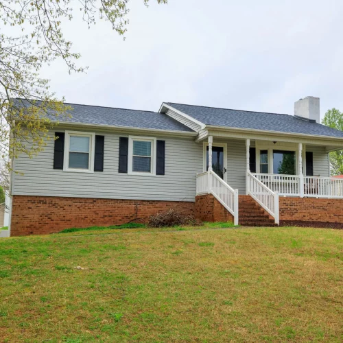Exterior of a ranch-style home captured for residential real estate listing in Lewisville, North Carolina.