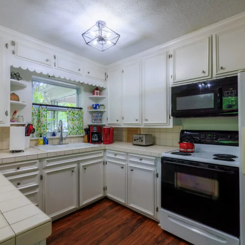 Bright kitchen interior with natural light showcased for a real estate listing.