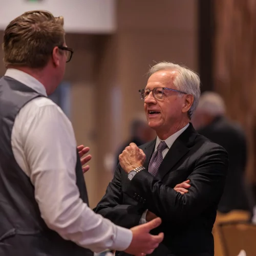 Networking conversation with the Mayor of Winston-Salem captured during professional event.