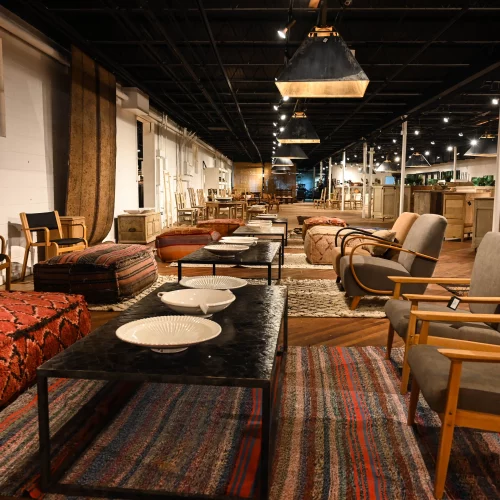 Upscale dining hall interior at High Point Furniture Market showcasing custom wood tables.