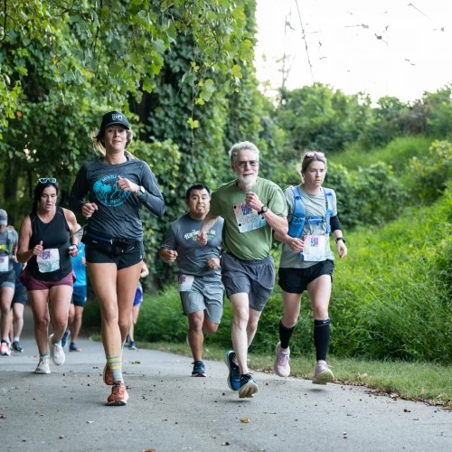Runners competing in a marathon outdoors in Greensboro, NC with lifestyle and athletic photography by MJS Live Productions.