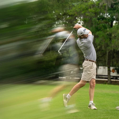 Golfer follow-through shot with a ghost filter lens, taken during professional event by MJS Live Productions.