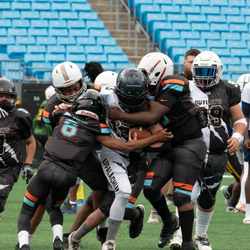 Team defensive formation captured during football event coverage by MJS Live Productions.