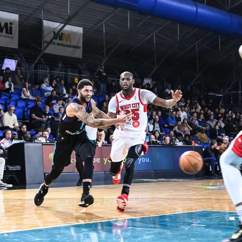 NBA G-League basketball players competing during professional indoor game covered by MJS Live Productions.