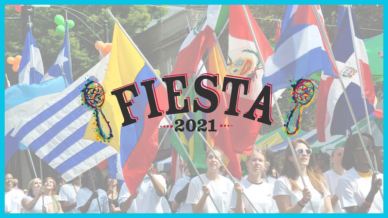 Cover photo for the Fiesta 2021 recap video featuring a parade of people carrying colorful international flags, with the word “FIESTA” in bold text overlaid on the image.