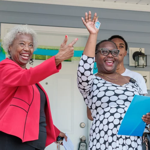 MJS Live Productions capturing a joyful moment as Habitat for Humanity of Forsyth County presents a new homeowner with the keys to their house during a dedication ceremony in Winston-Salem, North Carolina